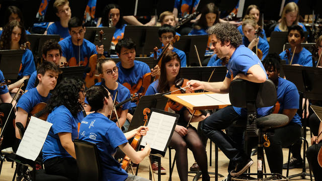 Gustavo Dudamel and young musicians at the Barbican