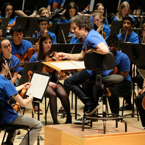 Gustavo Dudamel and young musicians at the Barbican