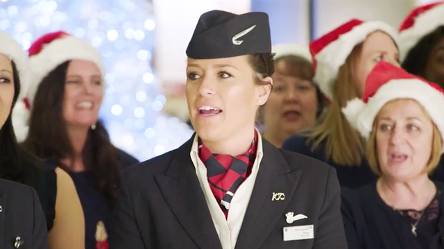 The cabin crew sang Christmas carols to thousands of airline passengers