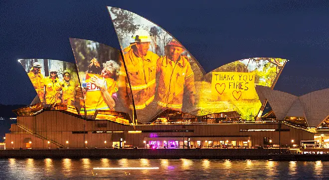 Sydney Opera House glows with images of heroic bushfire firefighters