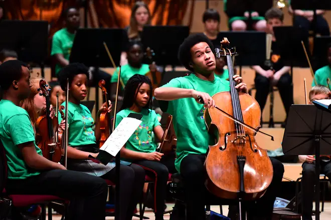 Sheku Kanneh-Mason performs on stage at the In Harmony 10th Anniversary Concert at the Philharmonic Hall