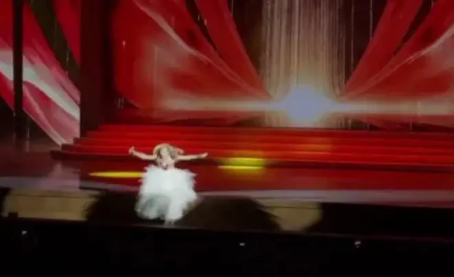 Heart-stopping moment a Russian singer falls 10 feet from stage