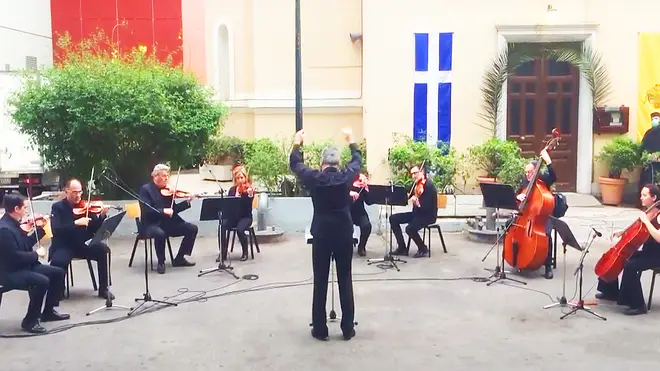 Greek orchestra performs musical tribute for frontline workers in hospital courtyard