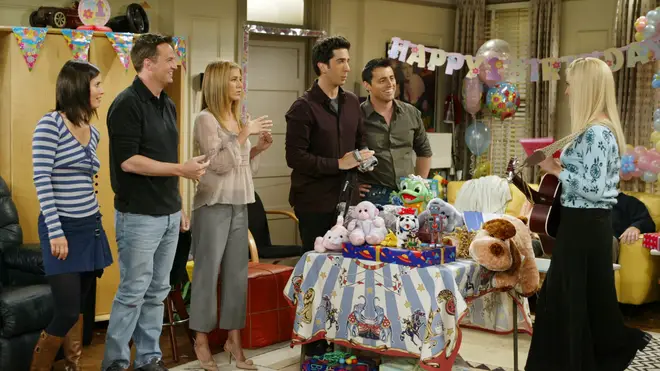 The cast of Friends enjoy a birthday song from Phoebe 