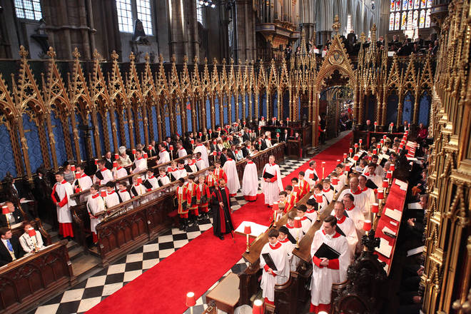 Choir members take their place in Westminster Abbey, London
