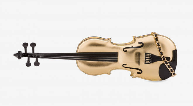 A high fashion brand is selling this very extra gold violin bag