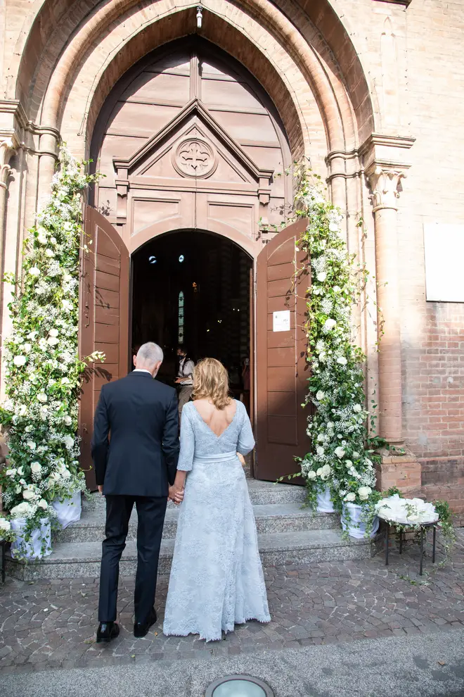 Nicoletta Mantovani and Alberto Tinarelli enter the church for the ceremony