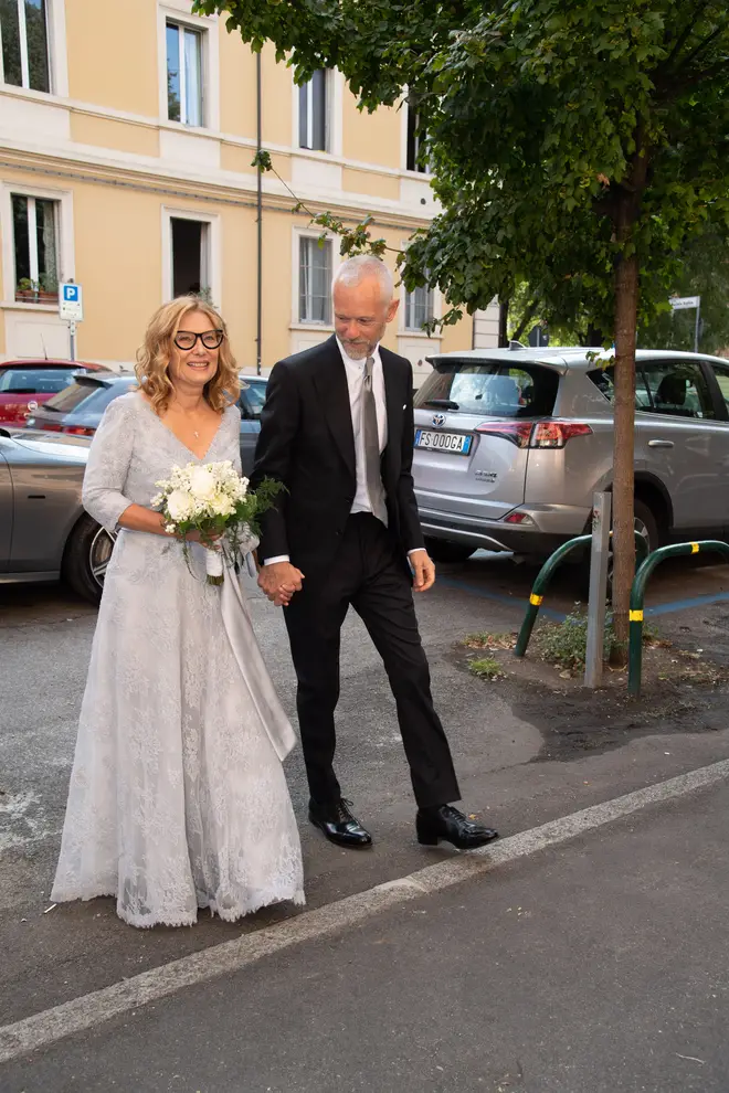 Nicoletta Mantovani and Alberto Tinarelli arrive at their wedding