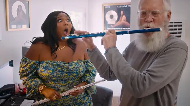 “No one can really do this!” Lizzo teaches David Letterman the flute.