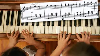 What is Chopsticks? Two girls play on piano