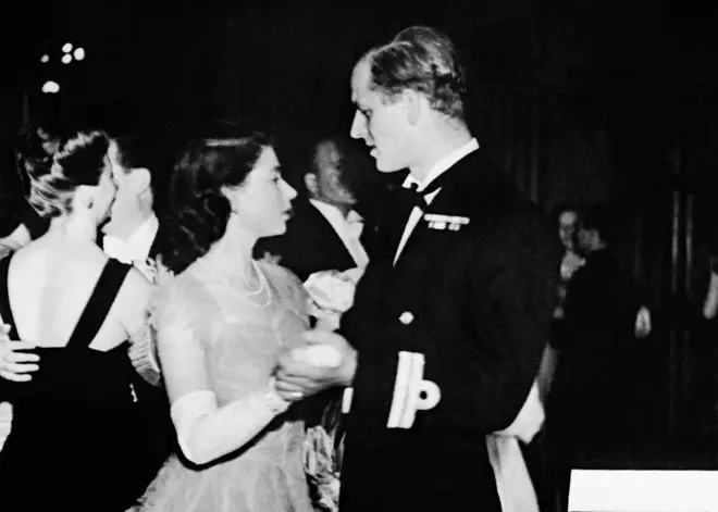 Princess Elizabeth dances with her fiancé, Lieutenant Philip Mountbatten, at a ball in Edinburgh (1947)