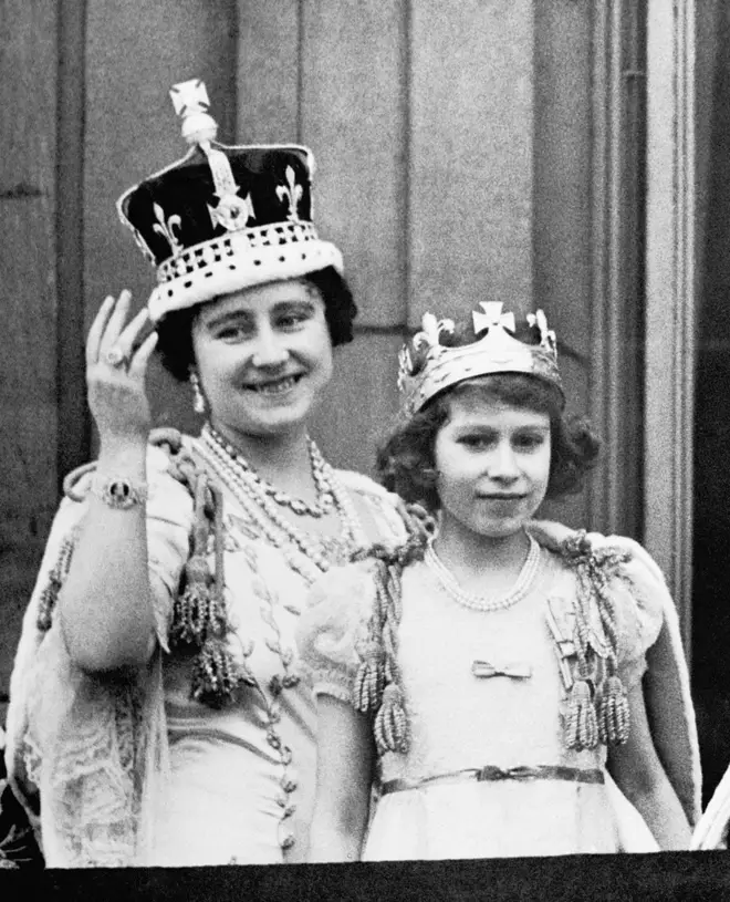 Princess Elizabeth stands with her mother, Queen Elizabeth, on the balcony of Buckingham Palace following the coronation of King George VI.