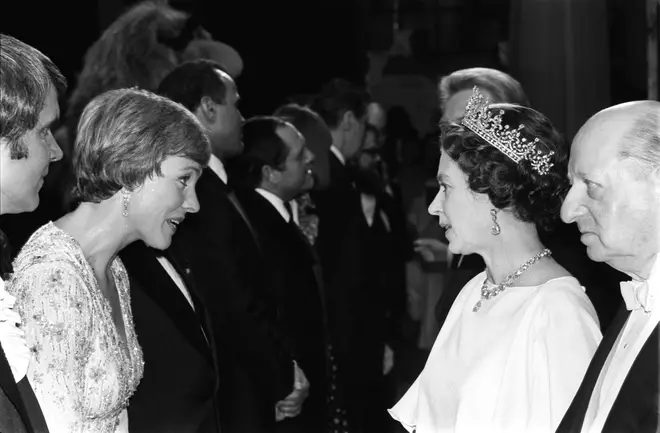 Queen Elizabeth II chats to actress Julie Andrews backstage at the London Palladium