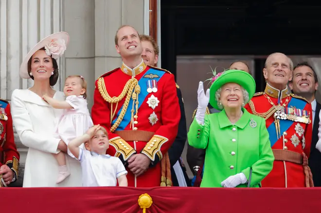 The Queen and Royal Family stand together on the balcony of Buckingham Palace during the Trooping The Colour