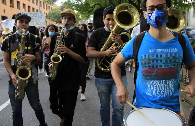 Musicians play in the march during a new day of protests in Medellín, Colombia