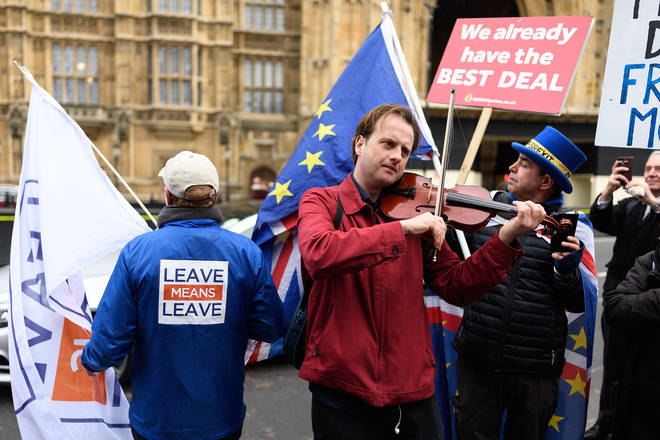 Musician protesting against Brexit Trade Deal outside Parliament