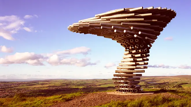 The 'Singing Ringing Tree' sits atop a hill overlooking Burnley