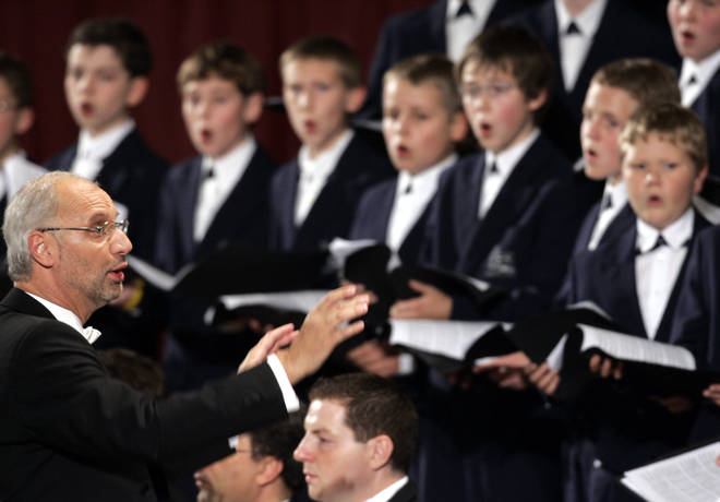 Regensburg Cathedral Choir director Roland Buchner conducts during a concert dedicated to Pope Benedict XVI at the Vatican