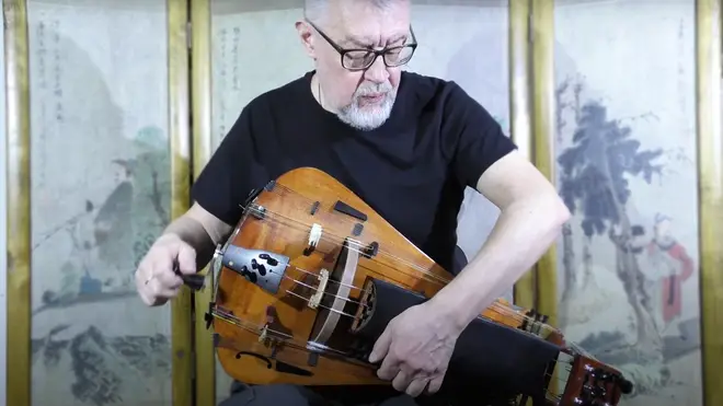 Hurdy-gurdy player cranks out a dark medieval melody give you goosebumps FM