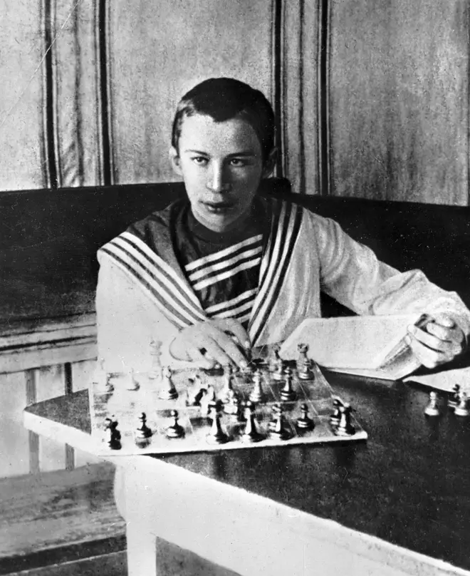 Young Sergei Prokofiev playing a highly competitive game of chess.