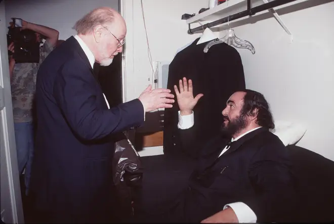 John Williams and Luciano Pavarotti clasping hands at the Grammy Awards. (1999)