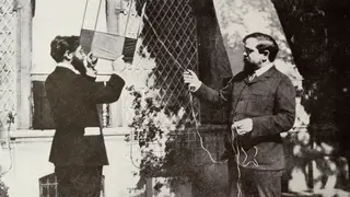 Claude Debussy flying a kite with Louis Laloy.