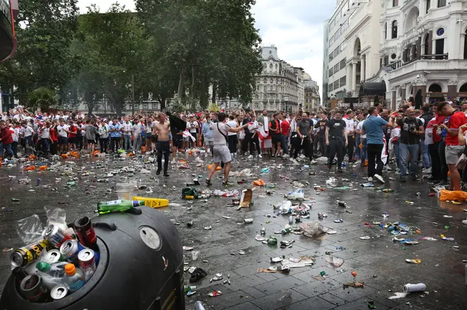 England fans leave a trail of litter across London's Leicester Square.