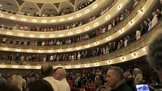 Cuba's President Miguel Diaz Canel listens to the national anthem at the Festival International de Ballet