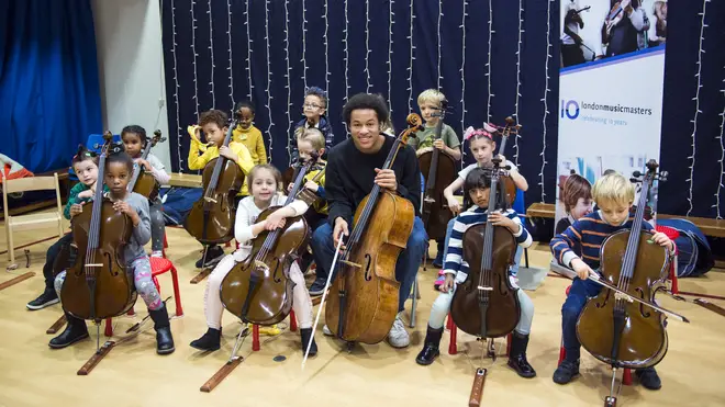 Sheku with children from Prior Weston Primary School