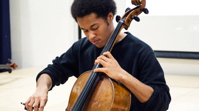 Sheku playing the cello