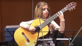 7-year-old classical guitar virtuoso plays with extraordinary passion and precision