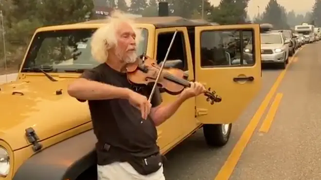 As Californians rush to escape wildfire, a solo violinist brings calm to traffic jam