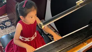 Brigitte Xie, 4, plays piano at piano teacher Felicia Feng Zhang's home in Greenwich, Connecticut, U.S. July 31, 2021.