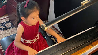 Brigitte Xie, 4, plays piano at piano teacher Felicia Feng Zhang's home in Greenwich, Connecticut, U.S. July 31, 2021.