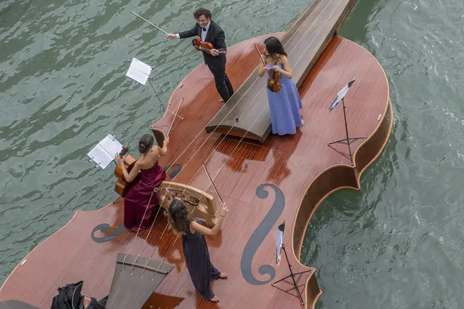 Watch a sublime string quartet serenade Venetians with Vivaldi on a boat shaped like a violin