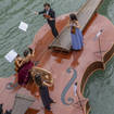 Watch a sublime string quartet serenade Venetians with Vivaldi on a boat shaped like a violin