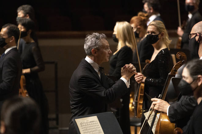 Fabio Luisi conducts a masked Dallas Symphony Orchestra and members of the Metropolitan Opera Orchestra