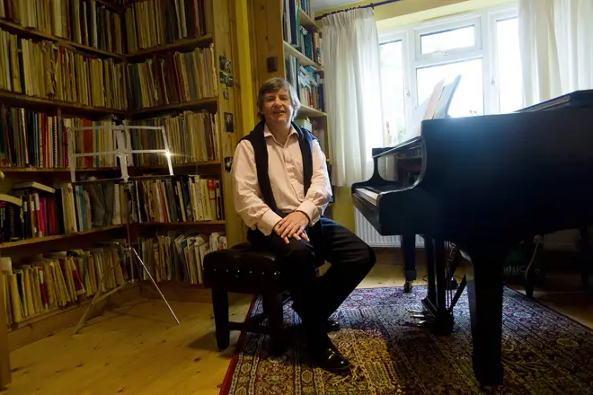 Piano teacher Daniel Nicholls, at the piano he taught the Middleton family, in Bucklebury