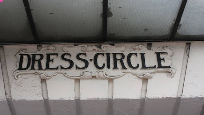 A sign for the Dress Circle entrance still remains