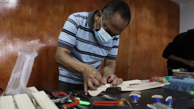 Peralta in his home workshop