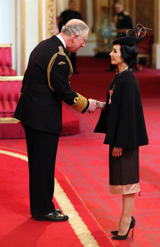 Rojo collects her CBE from Prince Charles