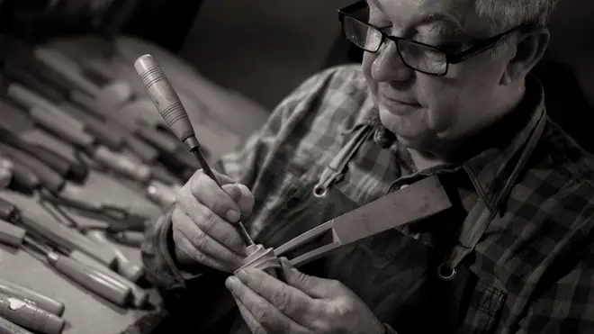 ó Dubhlaoidh working on his vegan violin