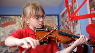 A girl in a Welsh primary school learns the violin