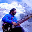 Mand performs for a crowd of climbers at Everest Base Camp