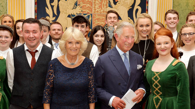 Camilla, Duchess of Cornwall and The Prince of Wales, pictured with performers from Northern Ireland in 2015