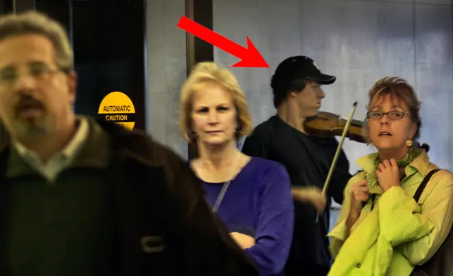 Violinist Joshua Bell busking in a Washington D.C Metro