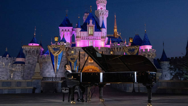 Lang Lang performs a Mary Poppins favourite in front of Sleeping Beauty’s Castle.