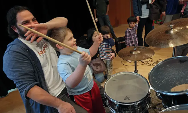Young drummer takes part in a Free Family Music series event at MacPhail Center for Music in downtown Minneapolis