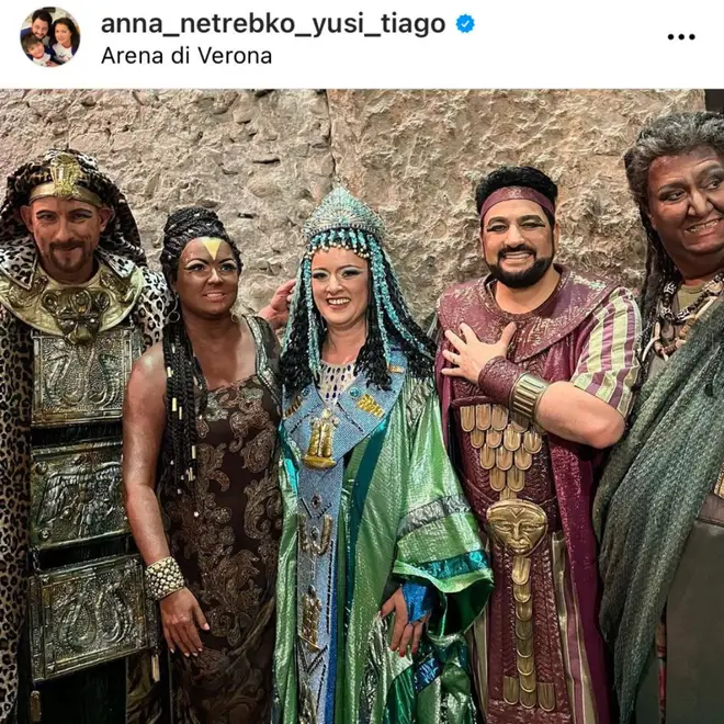 Anna Netrebko takes a photo with the rest of the cast at the Arena di Verona Opera Festival