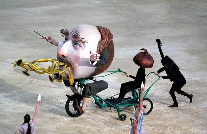 A large puppet depicting Elgar on his beloved bicycle is pushed by a person dressed as a cello at the opening ceremony of the 2022 Commonwealth Games in Birmingham’s Alexander Stadium.